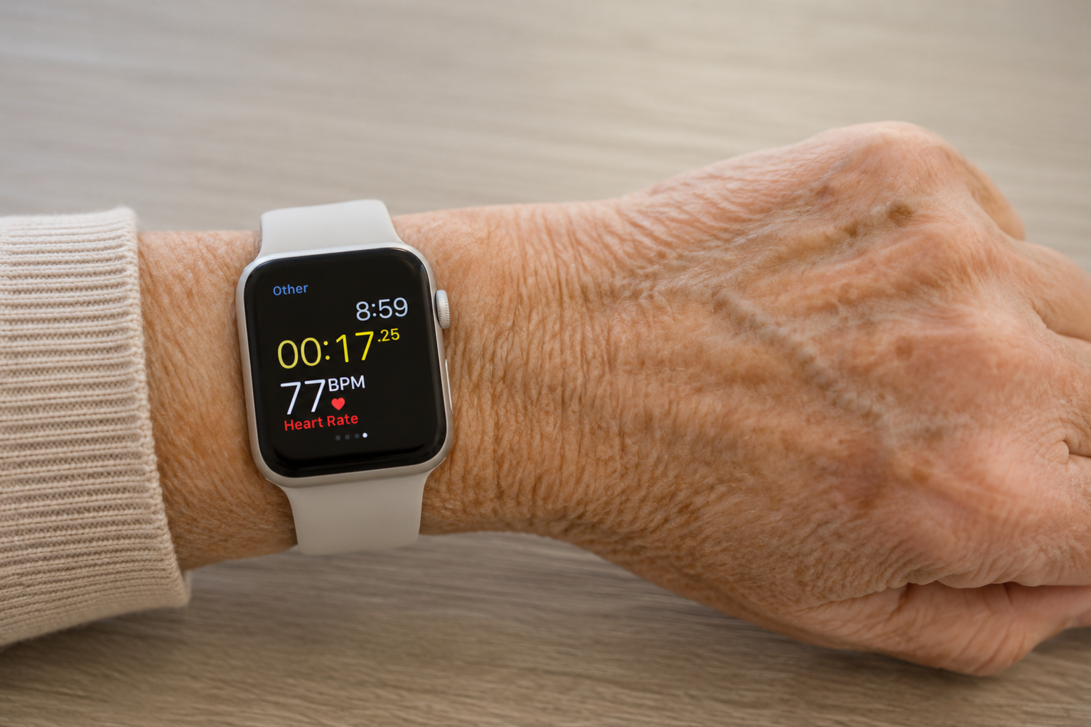 Smartwatch on a wrist measuring blood pressure, heart rate on elderly wrist
