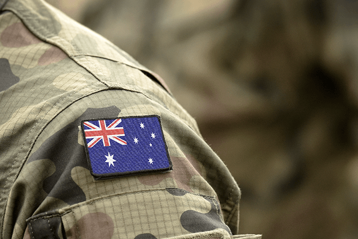 Australian flag patch on camouflage military uniform sleeve representing DVA Client support