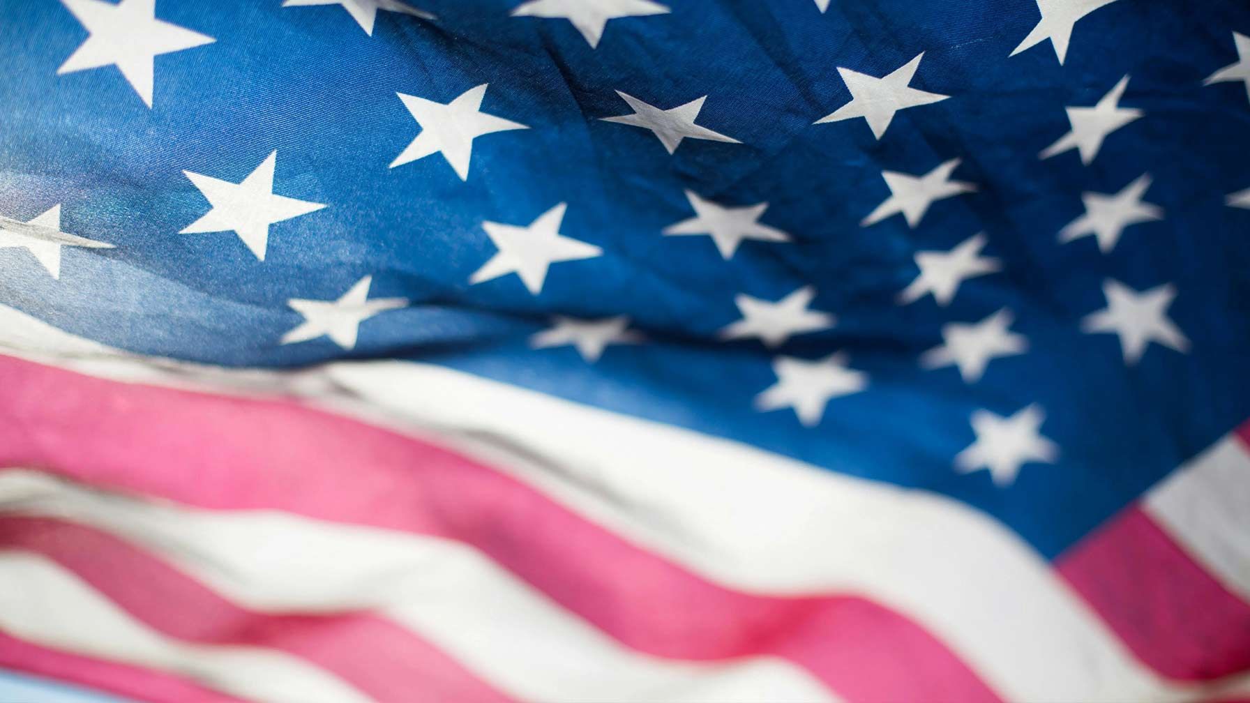 The American flag waving proudly, symbolizing the dedication of VP Insurance Services to protecting South Carolina families and the local Upstate community.