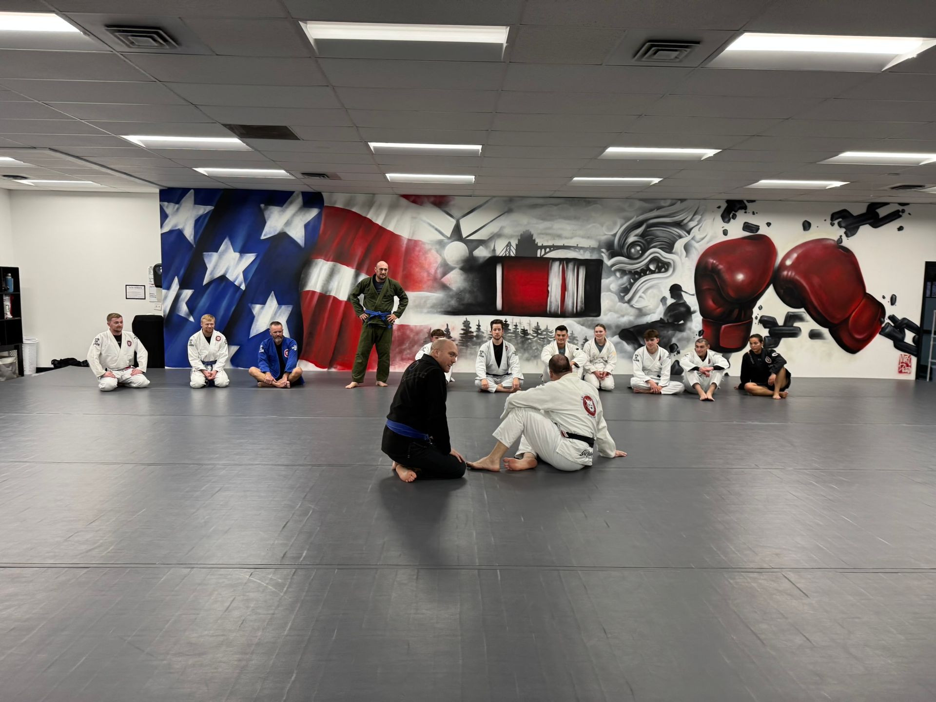 Adults training Jiu-Jitsu at Grit Jiu-Jitsu & Muay Thai Martial Arts in Spokane Valley, WA for stress relief.