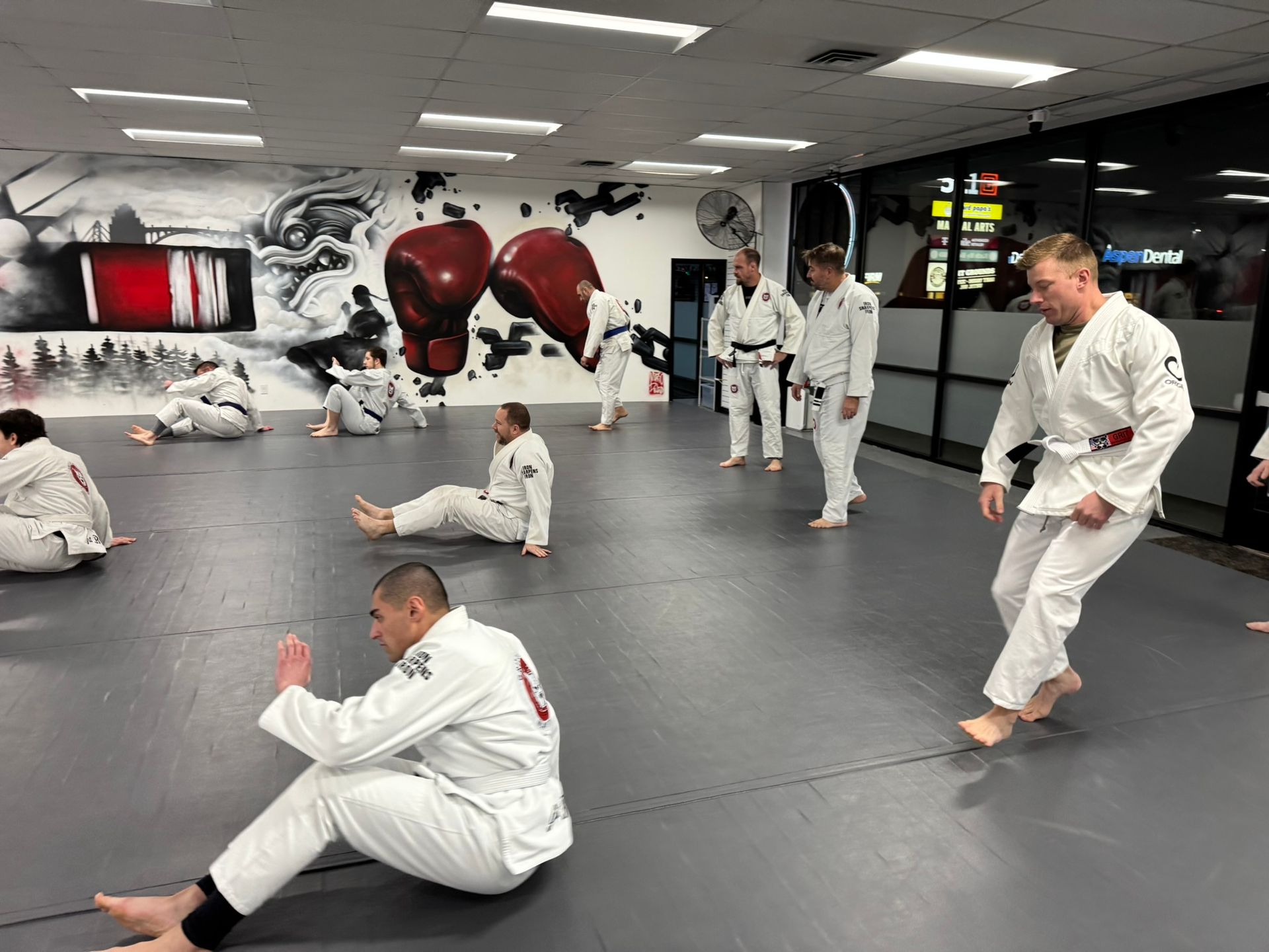 Adults practicing grappling drills at Grit Jiu-Jitsu & Muay Thai Martial Arts in Spokane Valley, WA for confidence