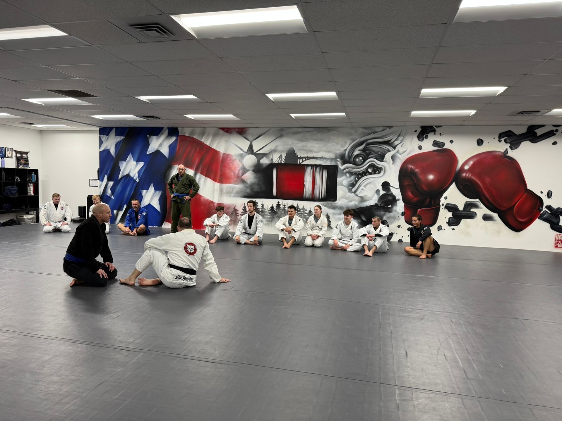 Adults drilling Jiu-Jitsu technique at Grit Jiu-Jitsu & Muay Thai Martial Arts in Spokane Valley, WA to build focus.