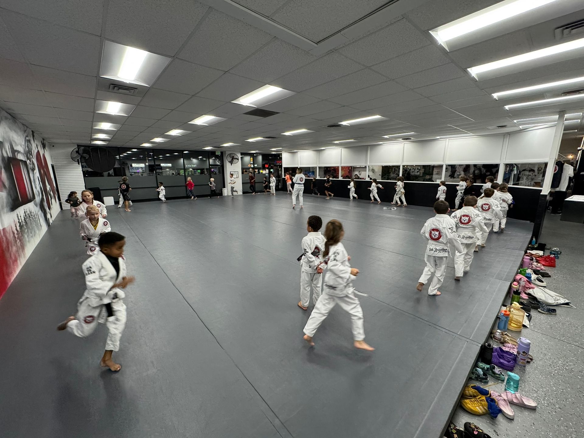 Kids practice safe Youth Jiu-Jitsu drills at Grit Jiu-Jitsu & Muay Thai Martial Arts in Spokane Valley for confidence.