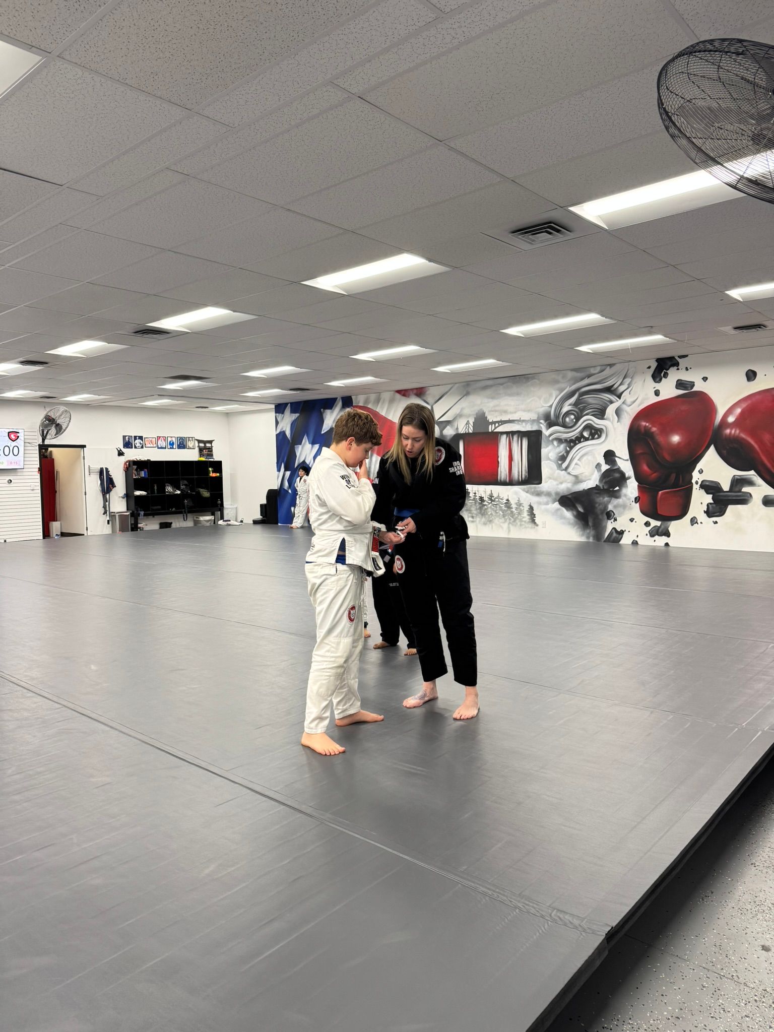 Kids practicing Youth Jiu-Jitsu with coaches at Grit Jiu-Jitsu & Muay Thai Martial Arts in Spokane Valley, WA, building confidence.