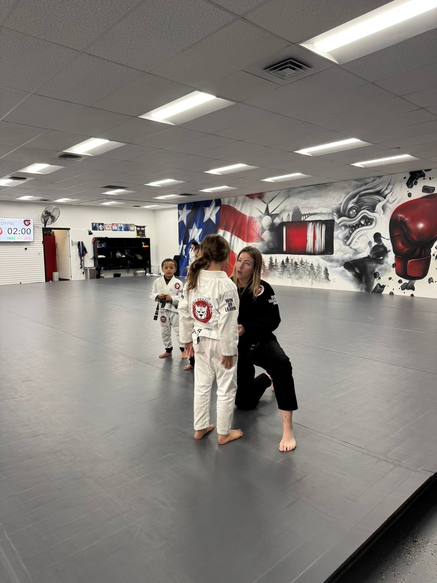 Kids practice safe grappling drills at Grit Jiu-Jitsu & Muay Thai Martial Arts in Spokane Valley, WA, building confidence.