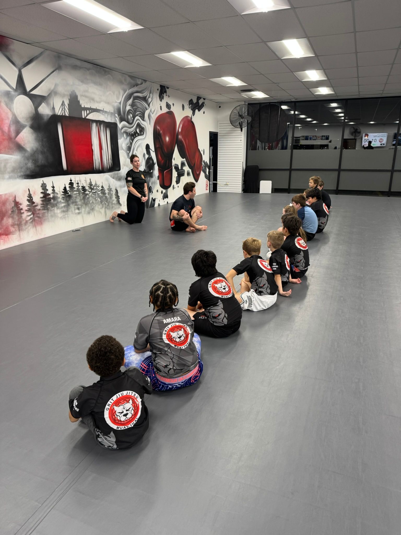 Kids practice controlled grappling in Youth Jiu-Jitsu at Grit Jiu-Jitsu & Muay Thai Martial Arts in Spokane Valley, WA.