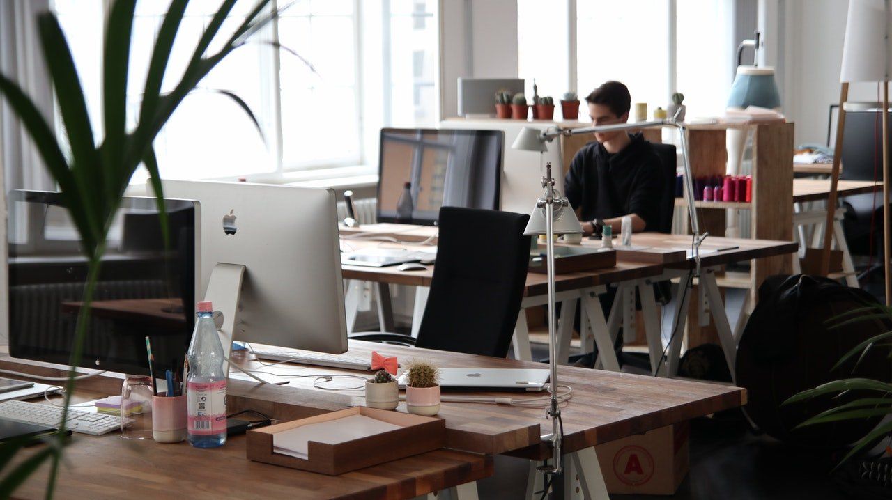 A person working alone in an office representing how to mentally prepare for going back to the office