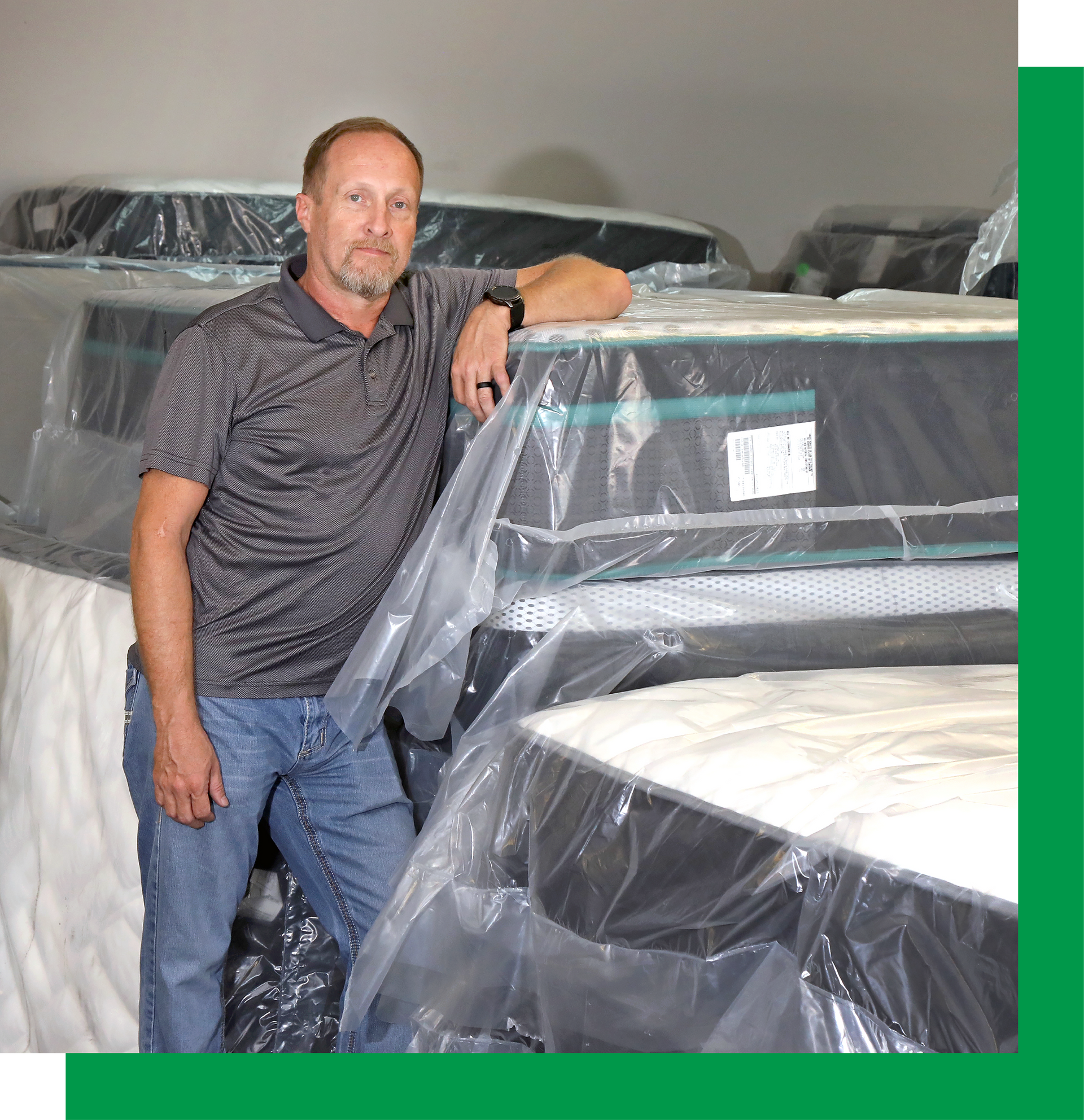 Owner and Veteran Justin in His showroom at Derby Mattress