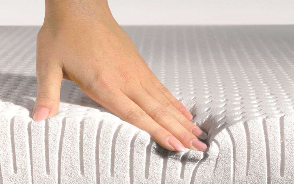 hand-on-latex-mattress Pure Talalay Bliss