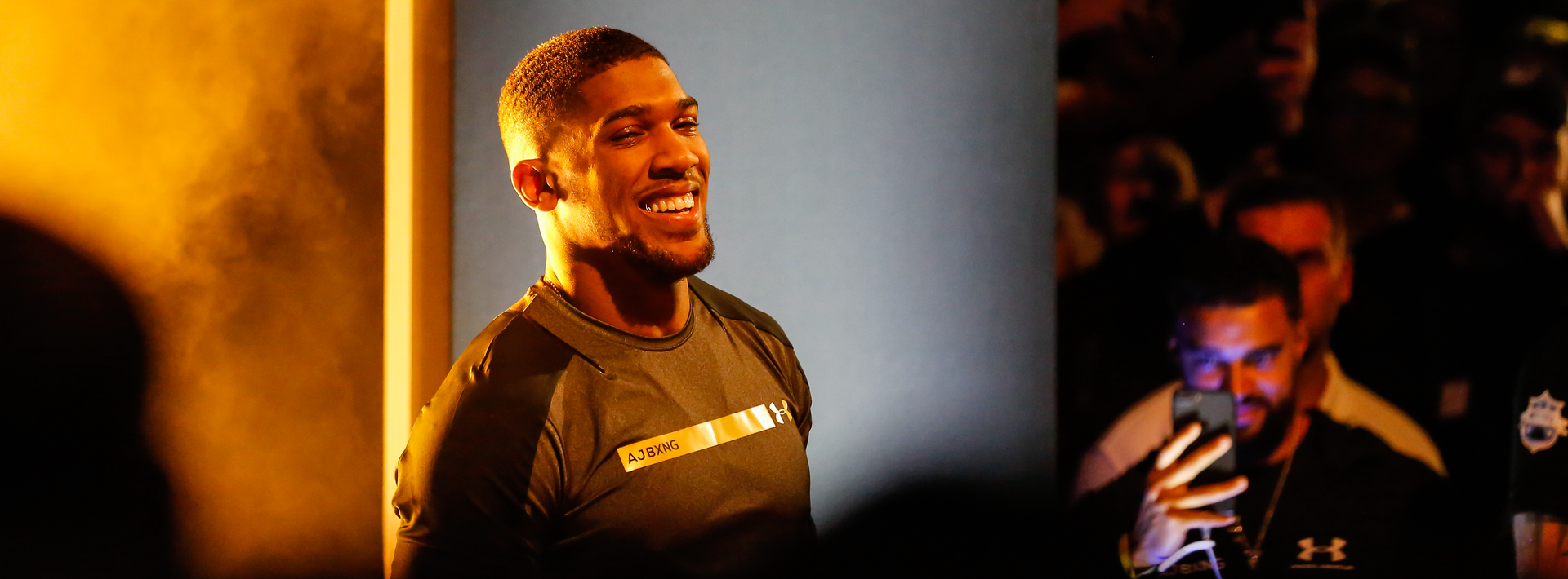 Anthony Joshua, renowned British heavyweight boxer, poses confidently ahead of his highly anticipated fight against Daniel Dubois at Wembley Stadium in 2024.