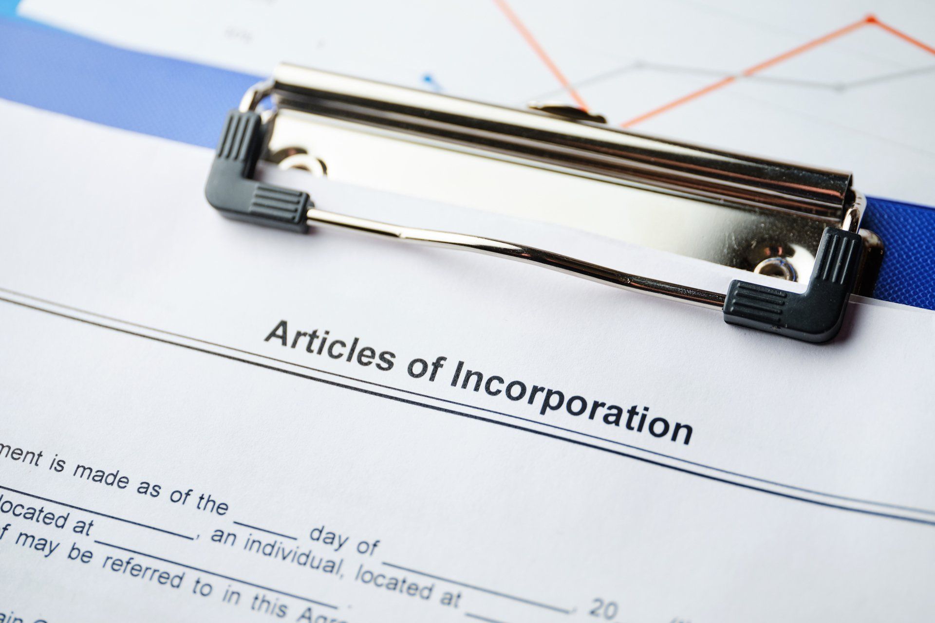 A clipboard with articles of incorporation written on it