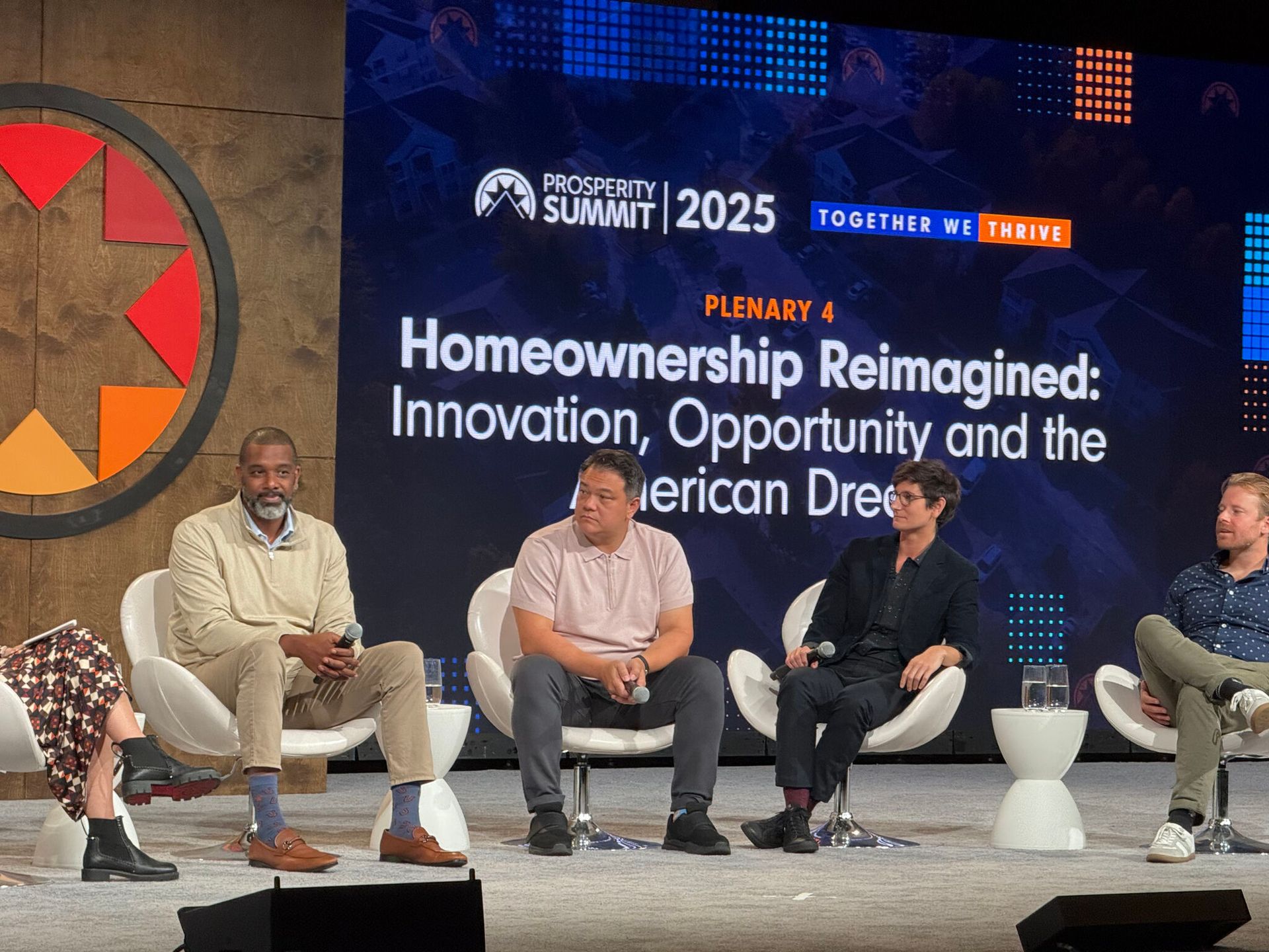 Three people with arms around each other, looking at a house. Evening setting with outlines.