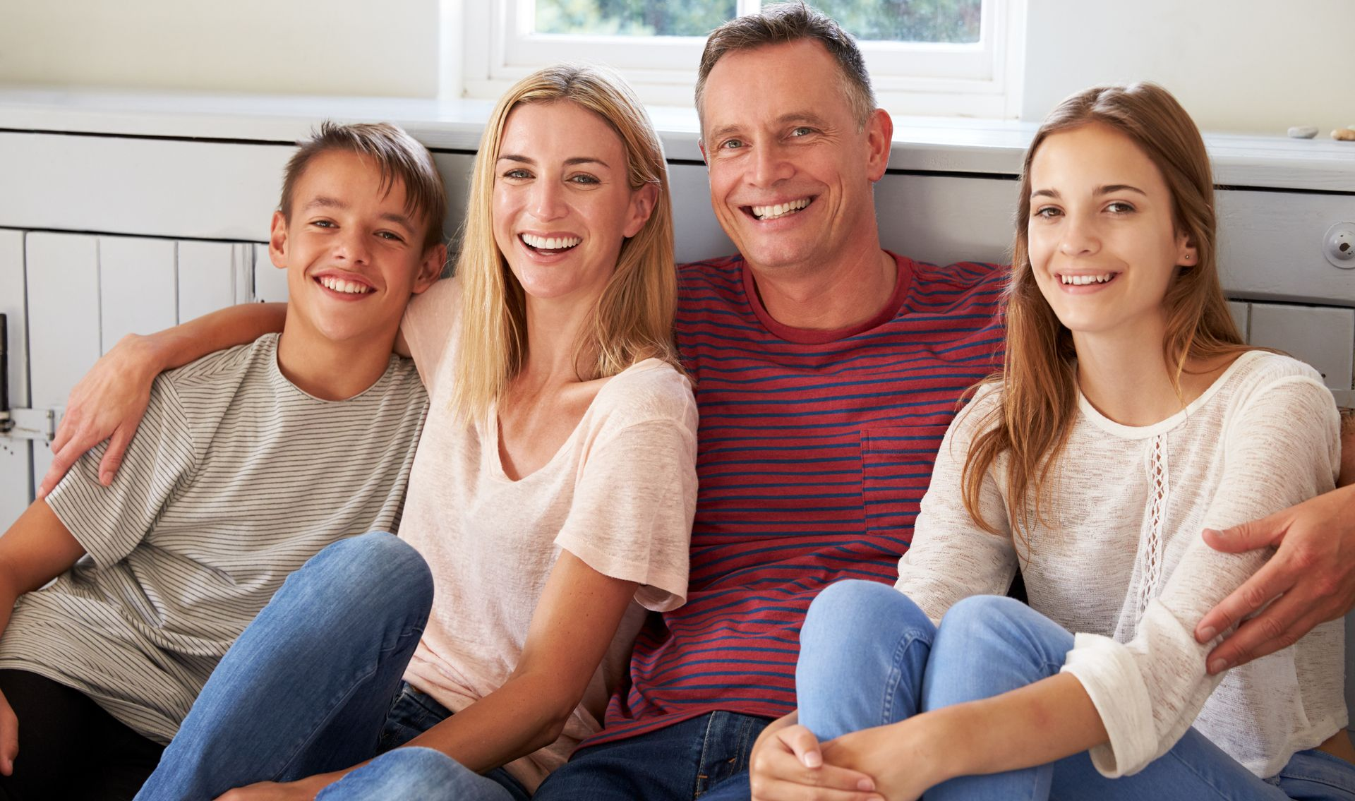 African American family with kids smiling - Family Dentist Mobile AL