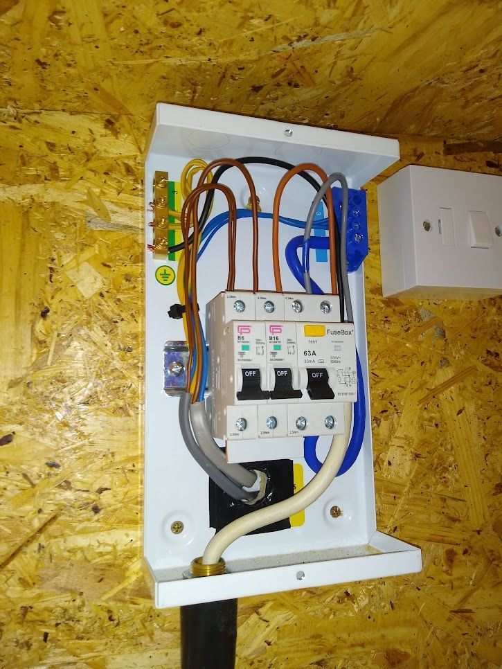 Fusebox garage consumer unit installed in an out building, for both power and lighting.