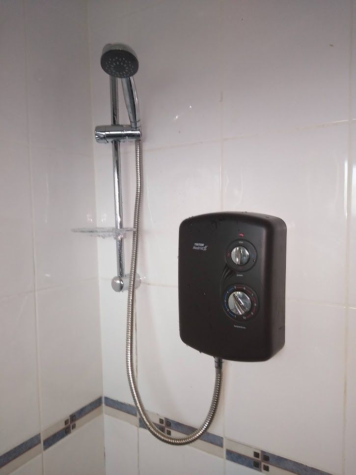 Electric shower replaced with a Triton Enrich Black, registered with Triton for additional warranty