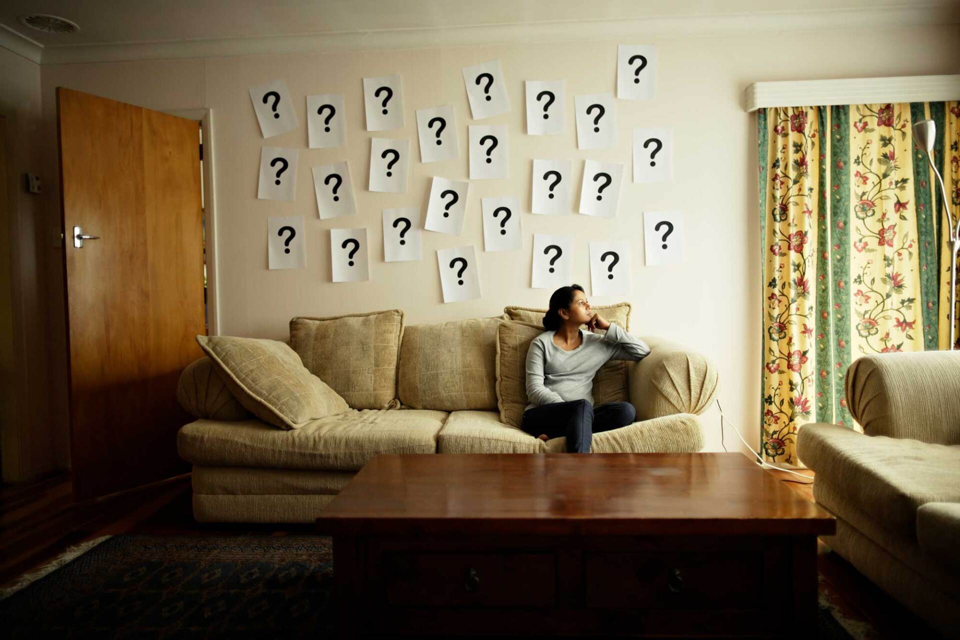 Question Marks on the Wall and a Woman Sitting on Sofa — White Plains, NY — Dr. Henry B. Hartman Question Marks on the Wall and a Woman Sitting on Sofa — White Plains, NY — Dr. Henry B. Hartman