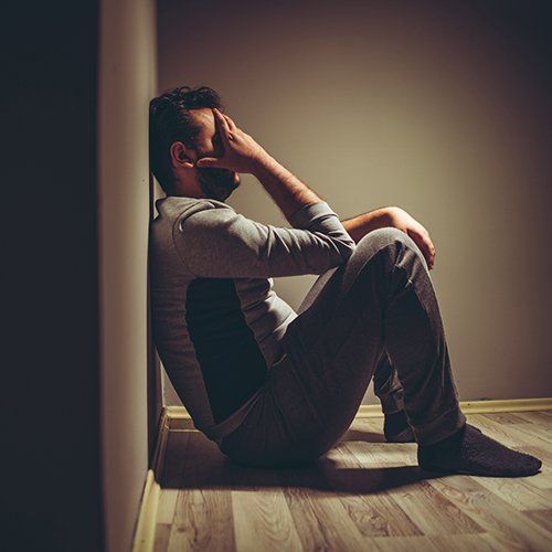 Depressed Man Sitting on Floor — White Plains, NY — Dr. Henry B. Hartman Depressed Man Sitting on Floor — White Plains, NY — Dr. Henry B. Hartman