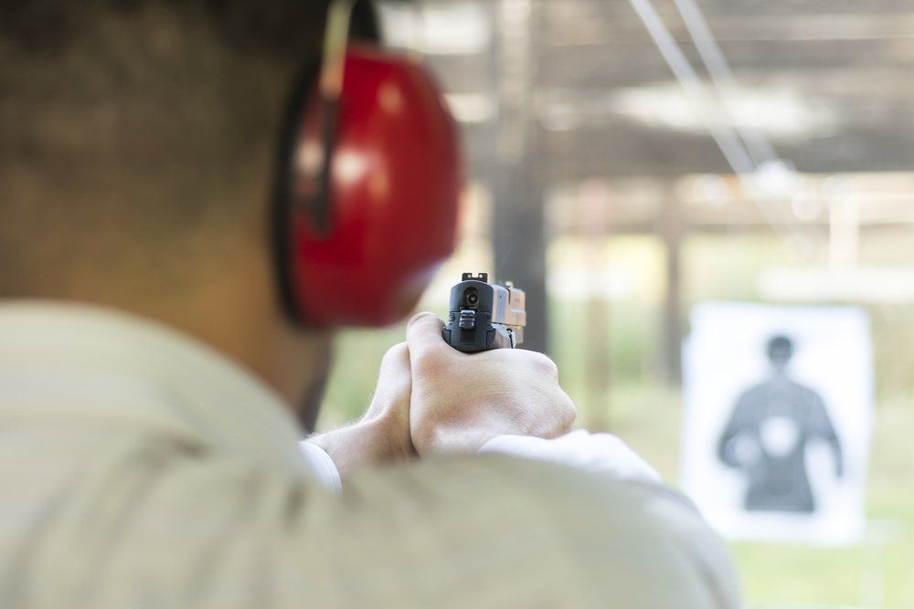 Man Practicing Fire Pistol Shooting