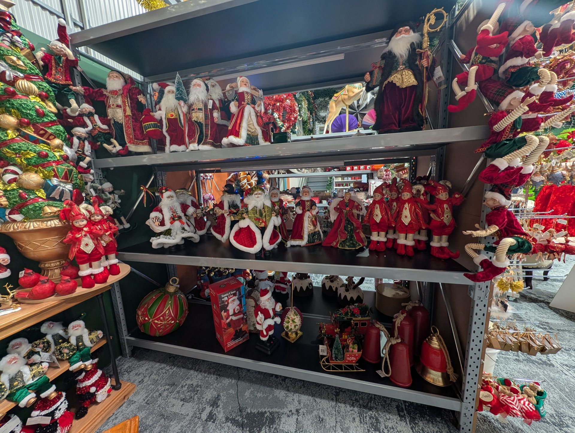 Shelves of Christmas Ornaments and Santa Figurines — Jingle Bell Christmas In Casino, NSW
