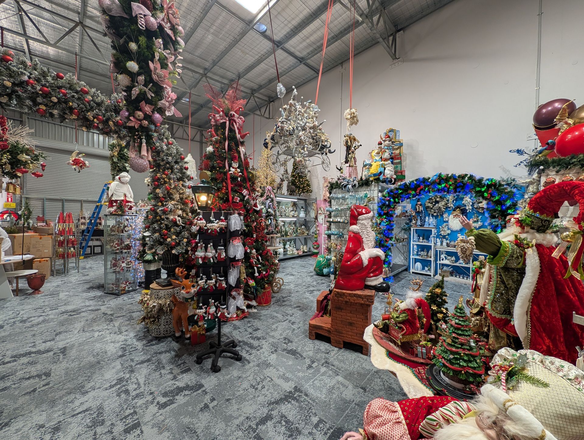 Christmas Shop with Decorated Trees, Wreaths, and Santa Figures — Jingle Bell Christmas In Casino, NSW