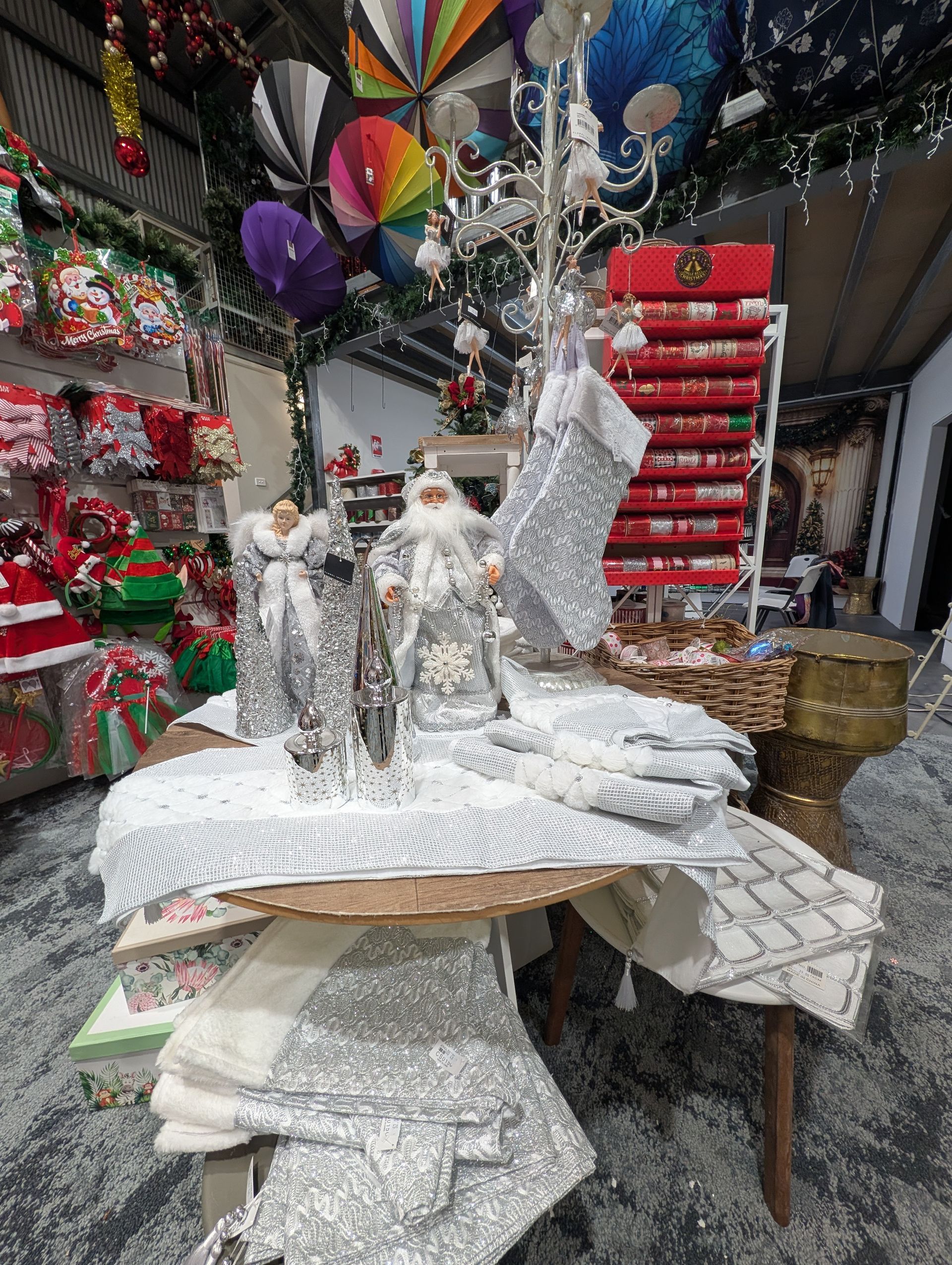 Holiday Craft Display with Silver Snowman Figurines — Jingle Bell Christmas In Casino, NSW