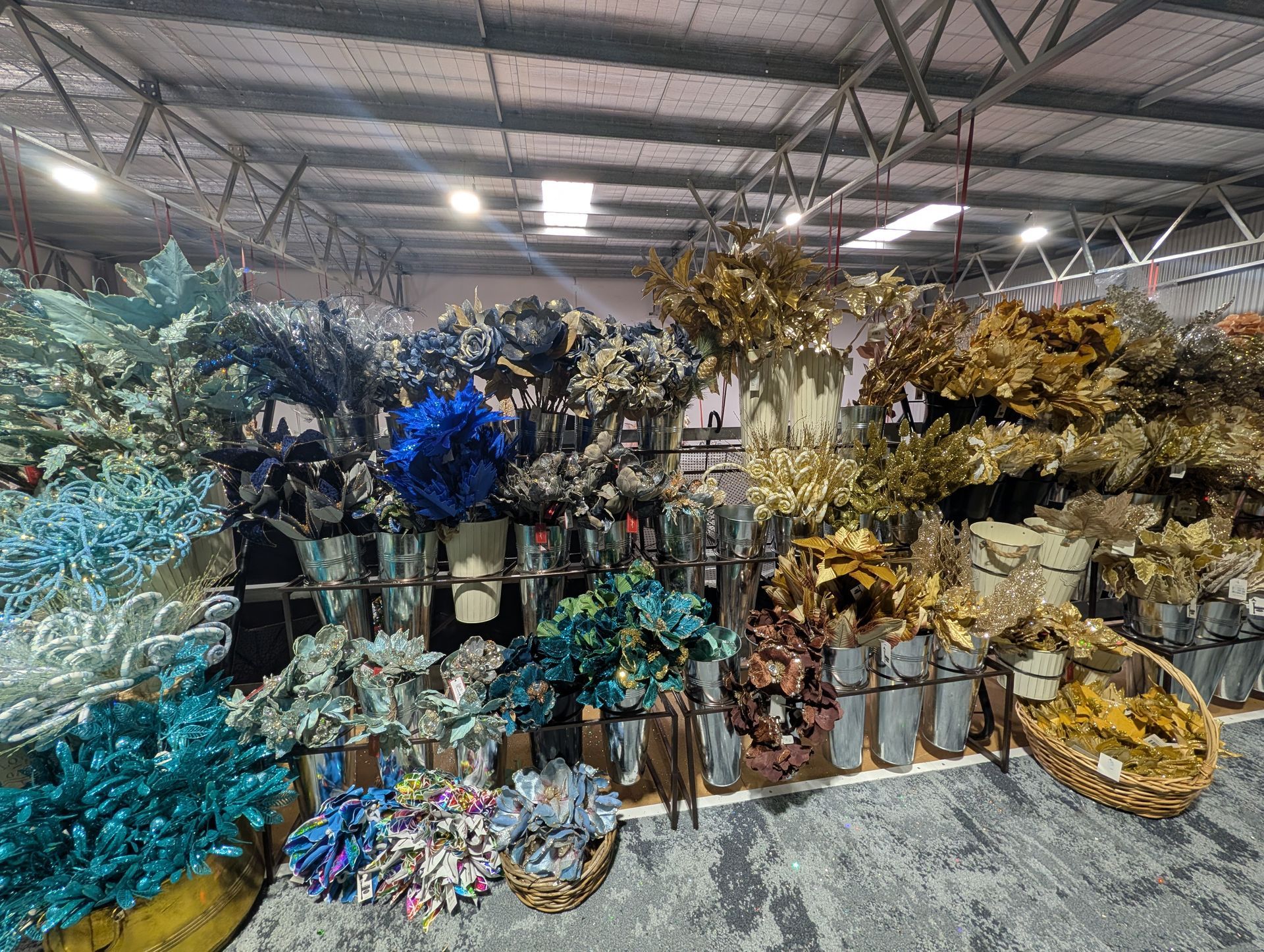 Warehouse Shelves Filled with Artificial Flowers and Decorative Foliage in Blue — Jingle Bell Christmas In Casino, NSW