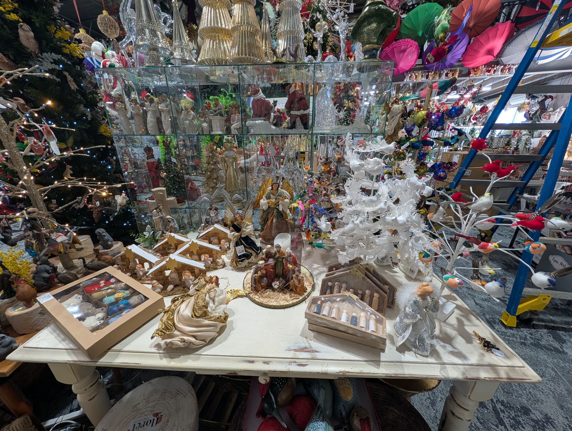 Table of Small Christmas Figurines and Decorations — Jingle Bell Christmas In Casino, NSW
