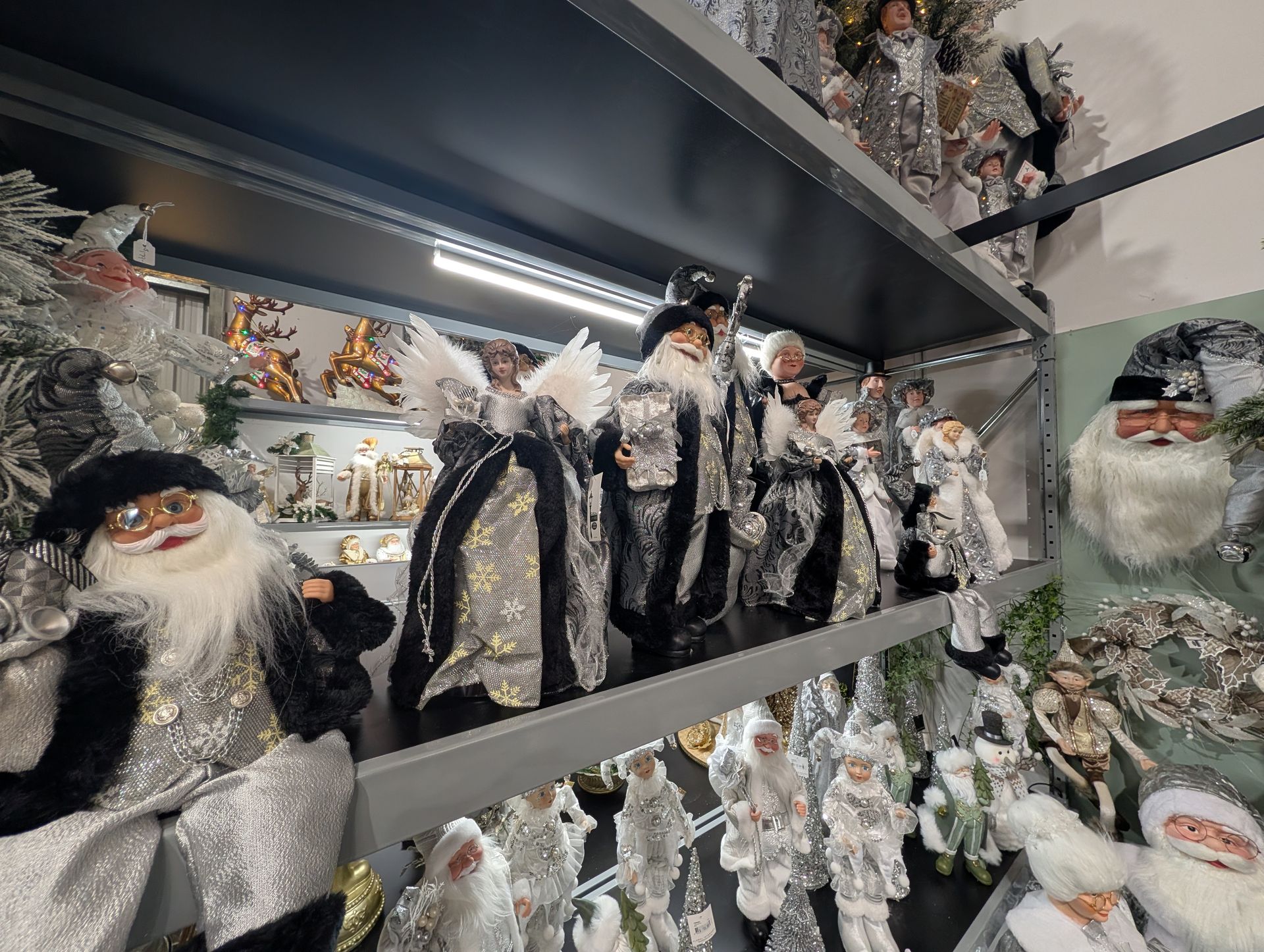 Shelf of Christmas Santa and Angel Figurines — Jingle Bell Christmas In Casino, NSW