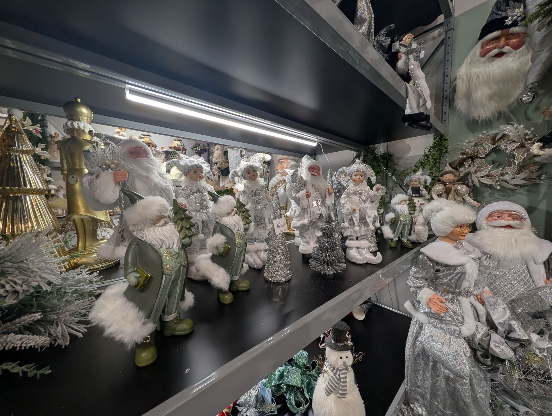 Shelves of Christmas Figurines and Snowy Holiday Decorations — Jingle Bell Christmas In Casino, NSW