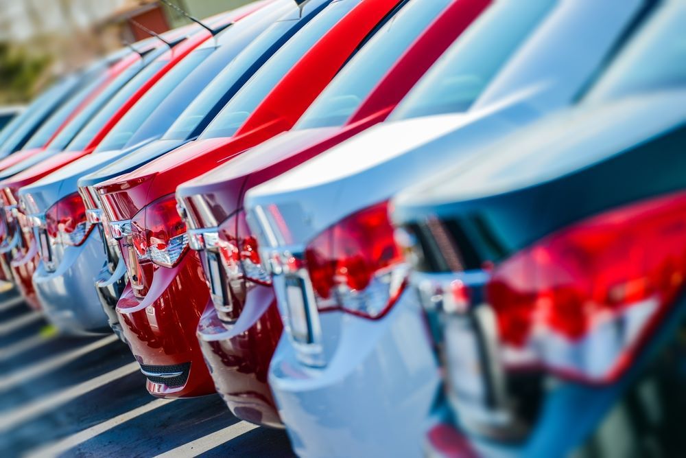A Row of Cars Are Parked Next to Each Other in a Parking Lot — Vanderpoel Smash Repairs in Gosford, NSW