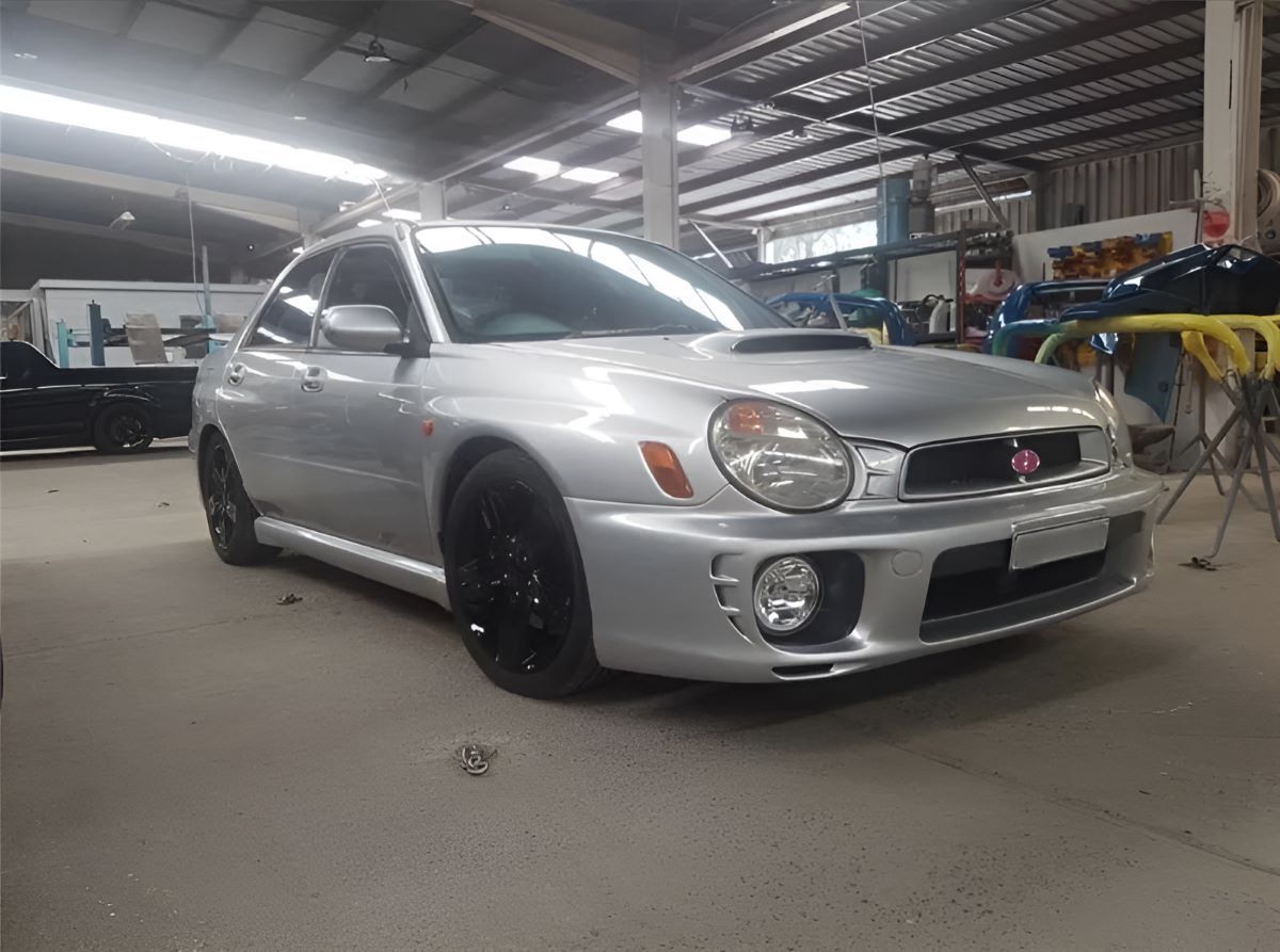 A Silver Subaru Wrx Sti is Parked in a Garage — Vanderpoel Smash Repairs in Tuggerah, NSW