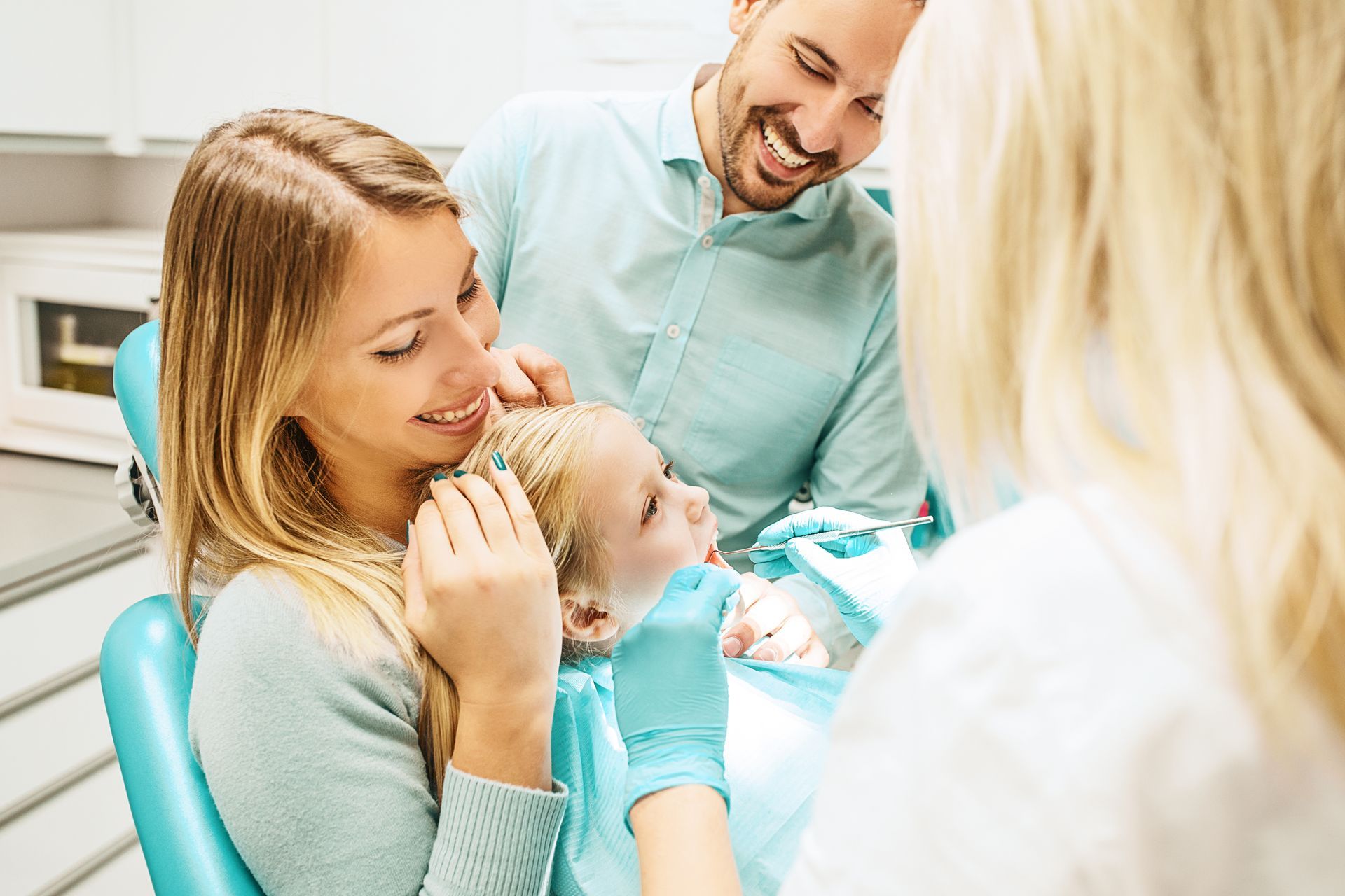 Family together during a child’s dental exam