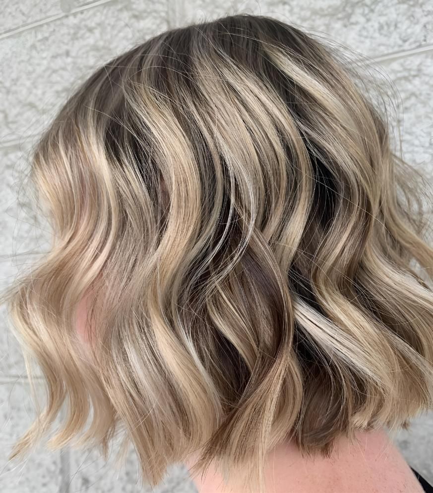 A Close Up Of A Woman's Hair With Blonde Highlights — Beautique Hair Lounge & Beauty Bar In Rasmussen, QLD