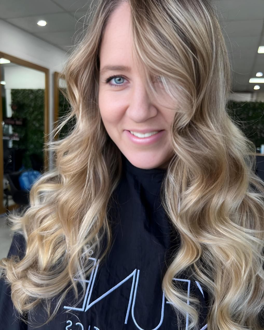 A Woman With Long Blonde Hair — Beautique Hair Lounge & Beauty Bar In Townsville, QLD