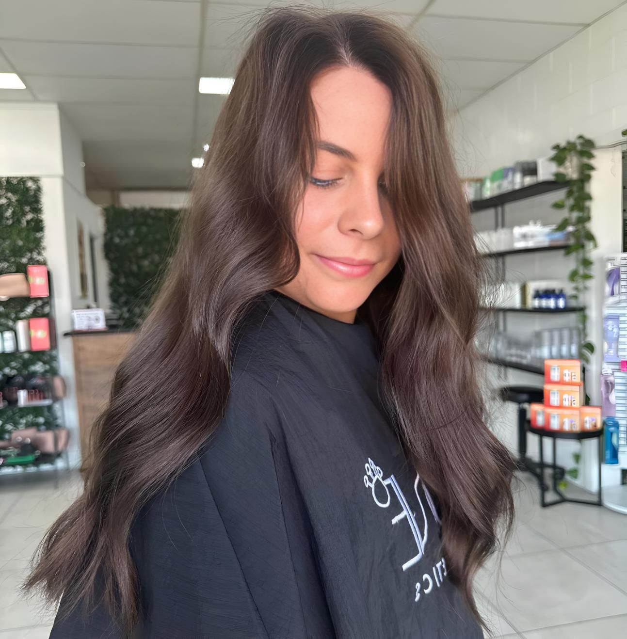 A Woman With Long Brown Hair — Beautique Hair Lounge & Beauty Bar In Rasmussen, QLD