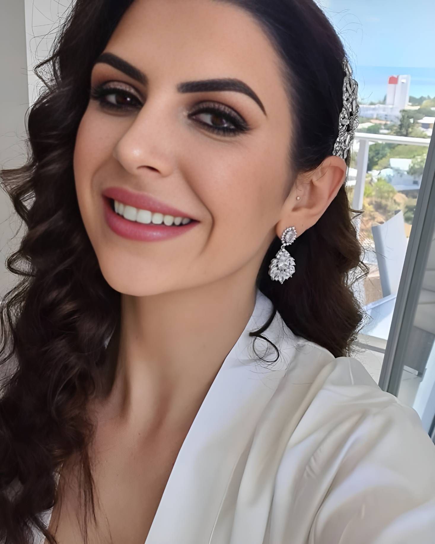 A Woman Wearing A White Robe And Earrings — Beautique Hair Lounge & Beauty Bar In Condon, QLD