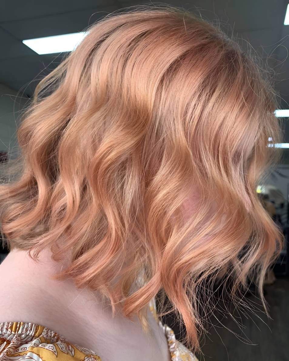 A Woman With Short Wavy Peach Hair — Beautique Hair Lounge & Beauty Bar In Condon, QLD
