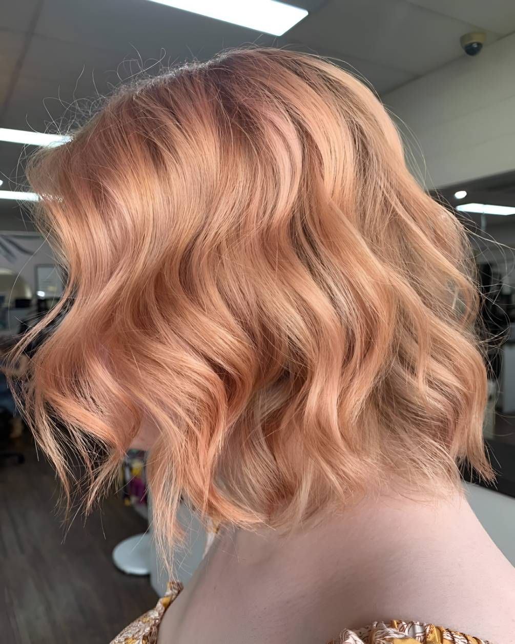 A Woman With Peach Hair Is Standing — Beautique Hair Lounge & Beauty Bar In Condon, QLD