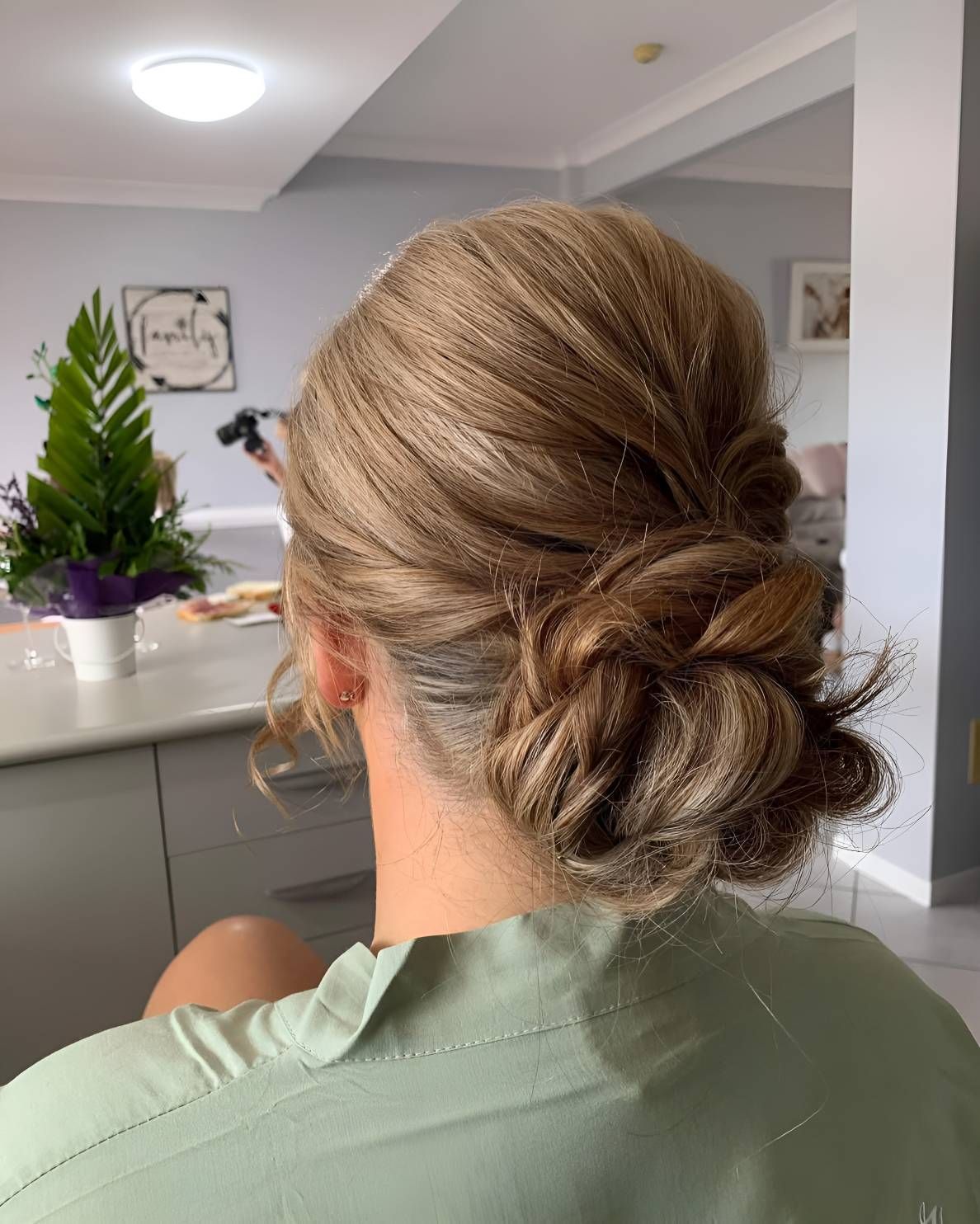 A Woman Is Sitting In A Mirror — Beautique Hair Lounge & Beauty Bar In Condon, QLD