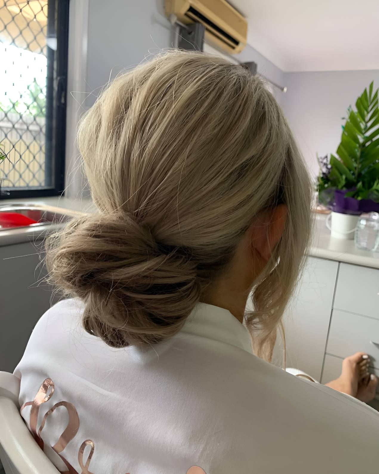 A Woman Her Hair Bun — Beautique Hair Lounge & Beauty Bar In Condon, QLD 