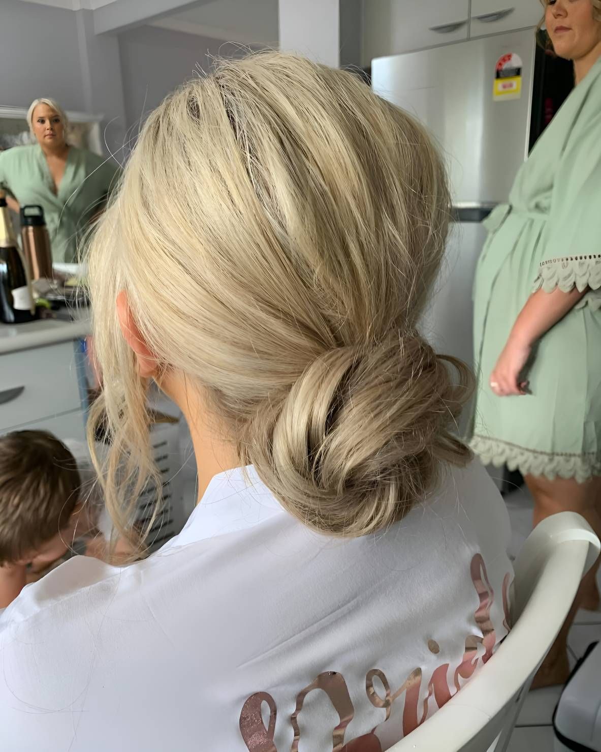 A Woman Is Sitting In A Chair — Beautique Hair Lounge & Beauty Bar In Condon, QLD