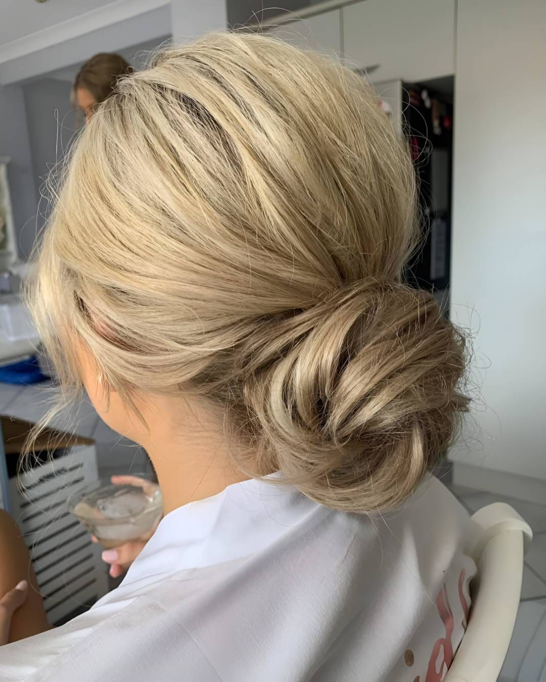 A Woman Is Sitting In A Chair — Beautique Hair Lounge & Beauty Bar In Condon, QLD