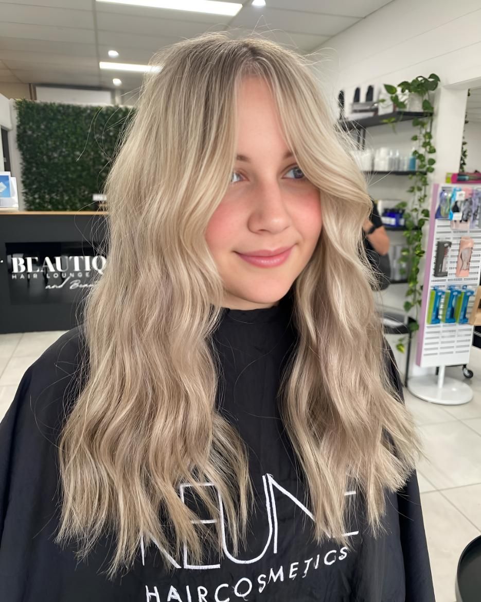 A Woman With Blonde Hair Is Wearing A Keune — Beautique Hair Lounge & Beauty Bar In Condon, QLD
