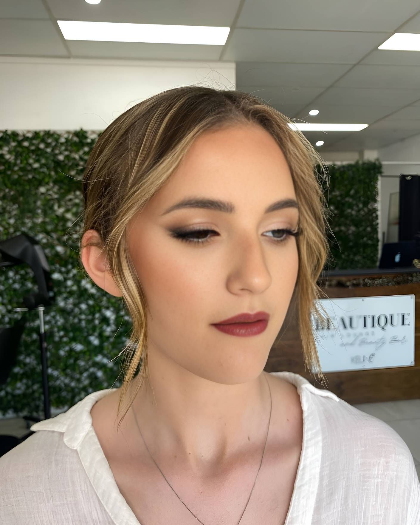 A Woman Is Wearing A White Shirt — Beautique Hair Lounge & Beauty Bar In Condon, QLD