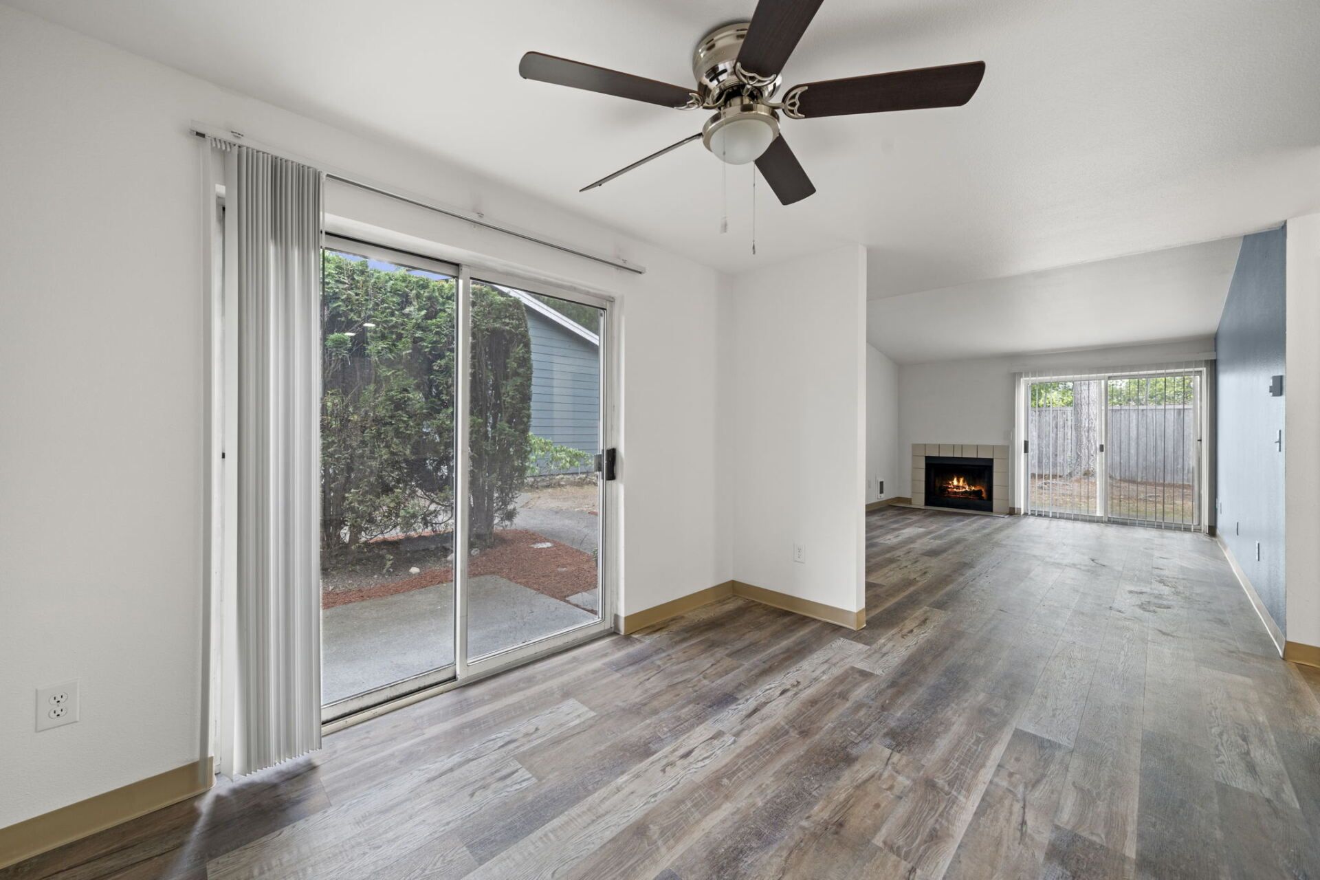 Dining looking into living room with fireplace