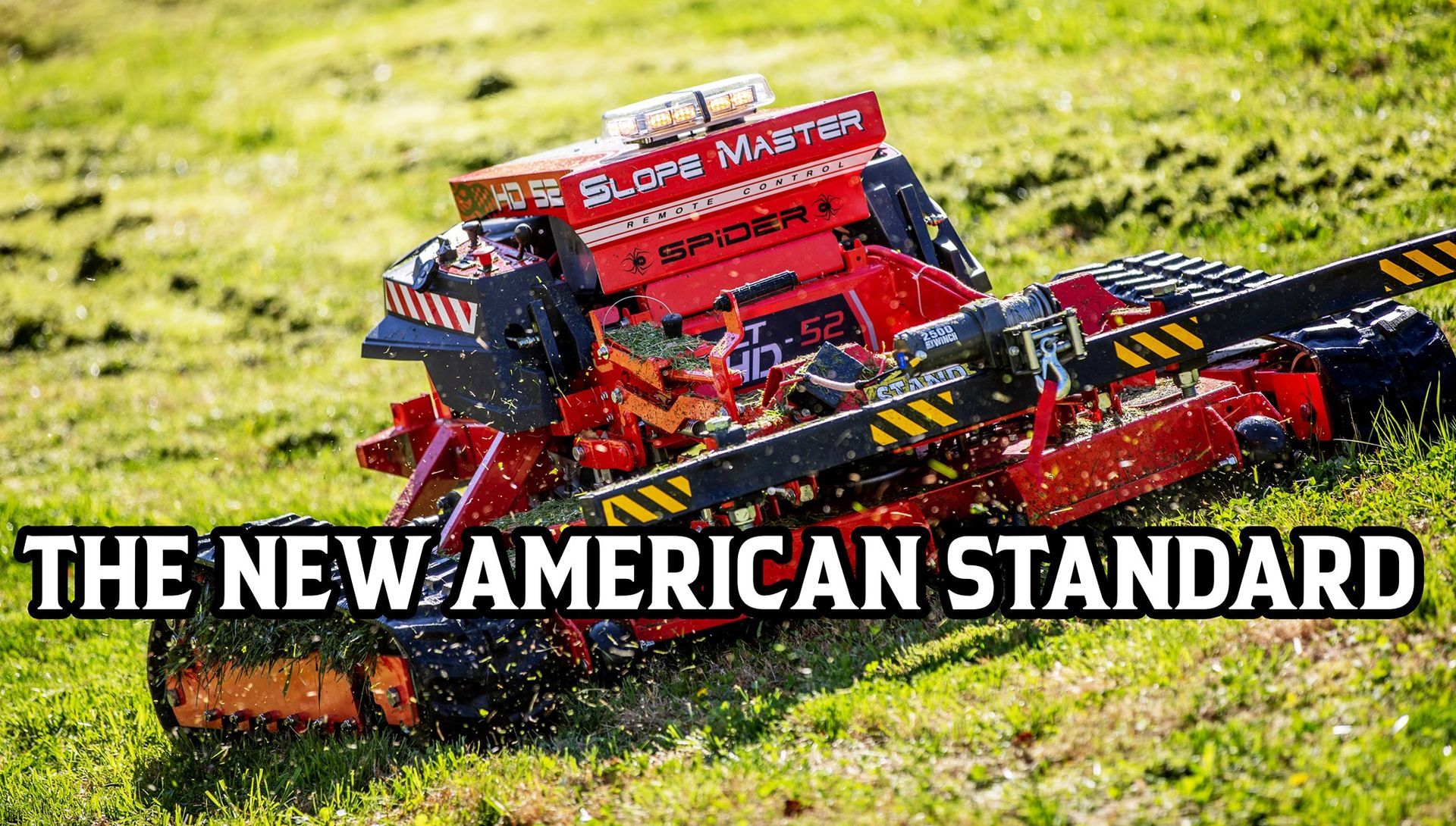 Red agricultural machine in a grassy field with text: “THE NEW AMERICAN STANDARD”
