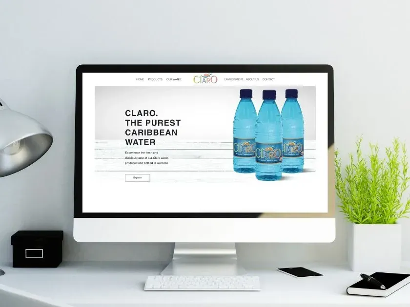Website design of a water brand with three bottles of water on the screen.