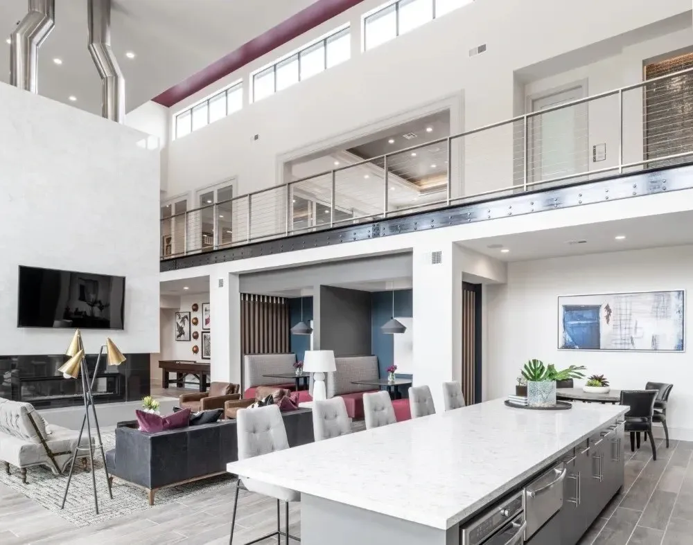 Stylish communal lounge area with modern furniture and a kitchen island