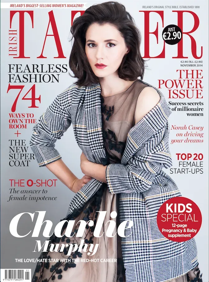 Magazine cover with a woman in a plaid coat. The cover reads