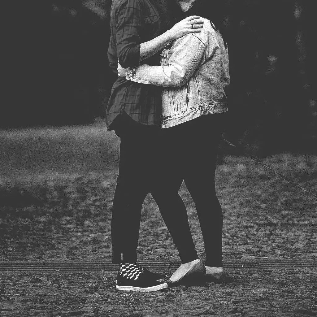 Couples Therapy to Strengthen Your Bond Couple embracing outdoors, representing the stronger connection couples therapy helps build.